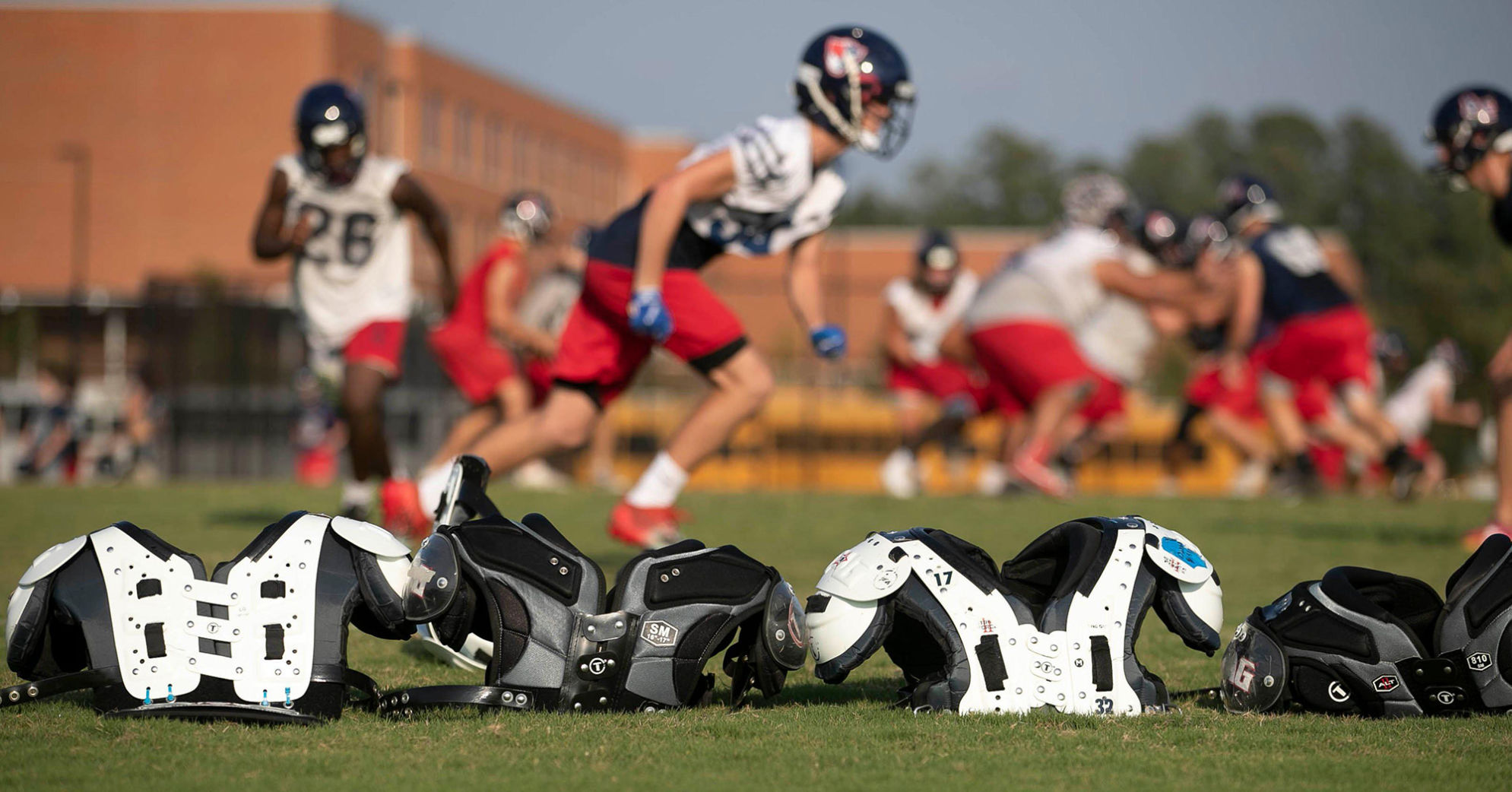 Apex Friendship football players work out on "No sweat Wednesdays," a day without pads, on Sept. 11, 2019 in Apex, N.C. Coach Adam Sanders has instituted a no contact practice after a visit to Dartmouth, which uses a similar system. Apex Friendship has fewer injuries and players are in better shape to play at their potential on game nights.